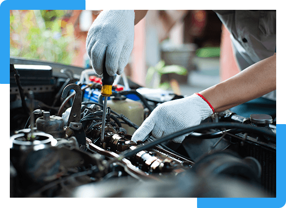 Auto mechanic repairing engine